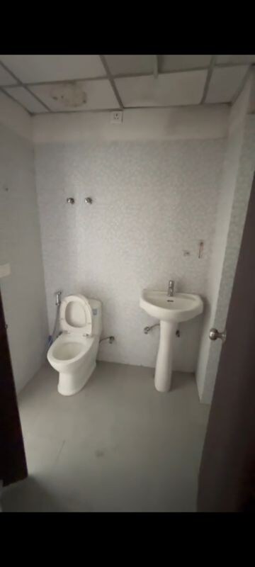 Bathroom in 2 BHK Apartment at Tulsiani Urban Woods, Sushant Golf City – for Sale