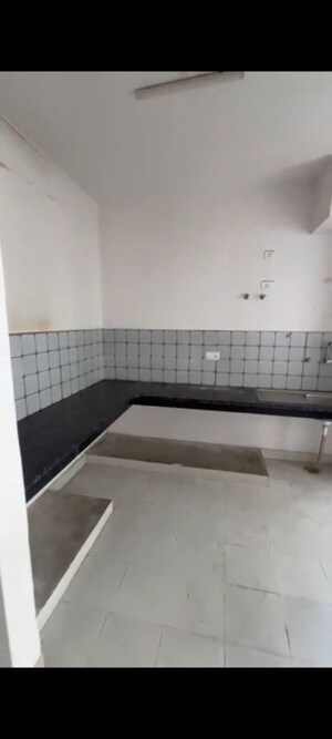 Kitchen in 2 BHK Apartment at Tulsiani Urban Woods, Sushant Golf City – for Sale