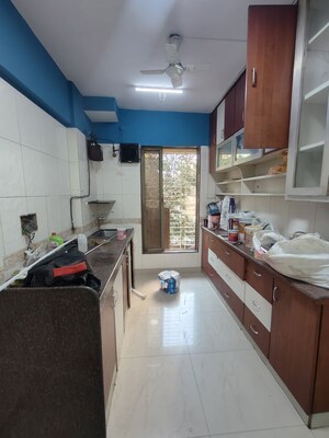 Kitchen in 2 BHK Apartment at Gulmohar Upvan CHS, Gawand Baug – for Rent