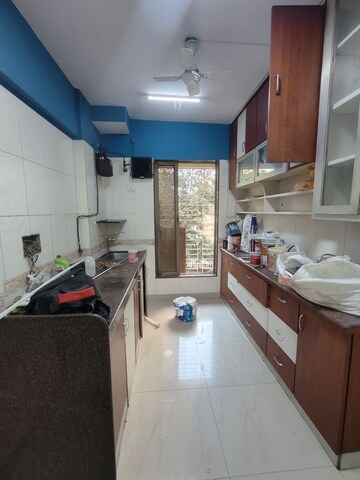 Kitchen in 2 BHK Apartment at Gulmohar Upvan CHS, Gawand Baug – for Rent