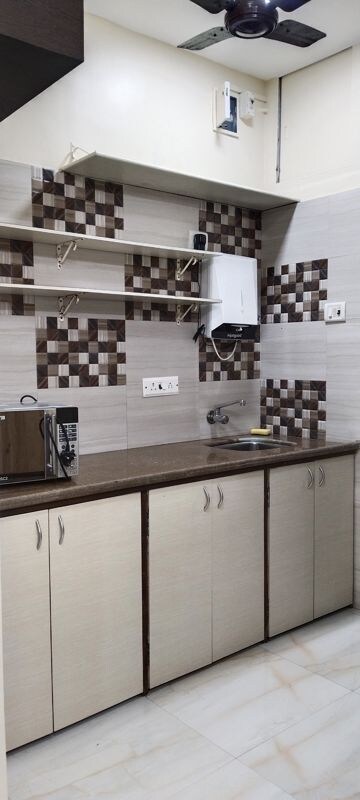 Kitchen in 1 BHK Apartment at Deepak Mahal CHS, Worli – for Rent