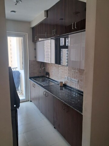 Kitchen in 2 BHK Apartment at Amrapali Heartbeat City, Sector 107 – for Rent
