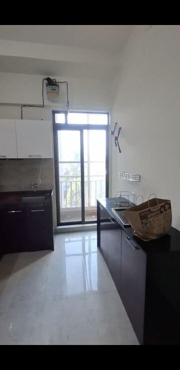 Kitchen in 3 BHK Apartment at Harmony Signature Towers, Owale – for Rent
