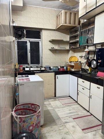 Kitchen in 2 BHK Apartment at Vishwageet CHS, Andheri West – for Rent