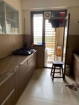 Kitchen in 3 BHK Apartment at Bhimjyani Verraton, Manpada – for Rent