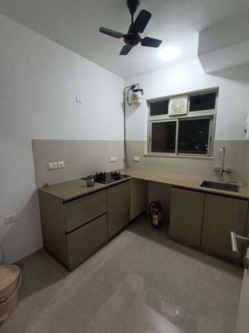 Kitchen in 1 BHK Apartment at Hiranandani Estate Solitaire C, Ghodbunder Road – for Rent