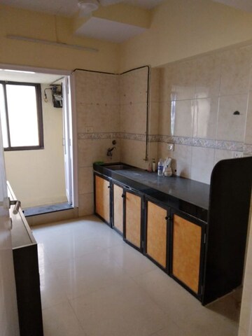 Kitchen in 2 BHK Apartment at K Raheja Palm Court, Malad West – for Rent
