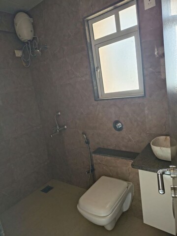 Bathroom in 1 BHK Apartment at Lalani Residency, Kavesar – for Rent