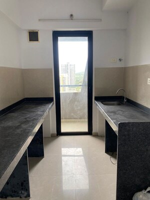 Kitchen in 1 BHK Apartment at Lodha Lakeshore Greens, Dombivli East – for Rent