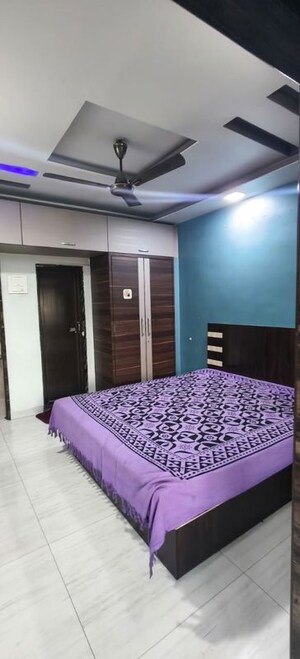 Bedroom in 2 BHK Apartment at Om Balaji Kripa CHS, Nerul Sector 19 – for Rent