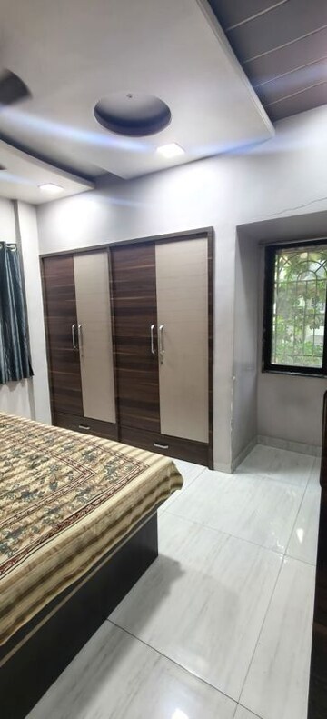 Bedroom in 2 BHK Apartment at Om Balaji Kripa CHS, Nerul Sector 19 – for Rent