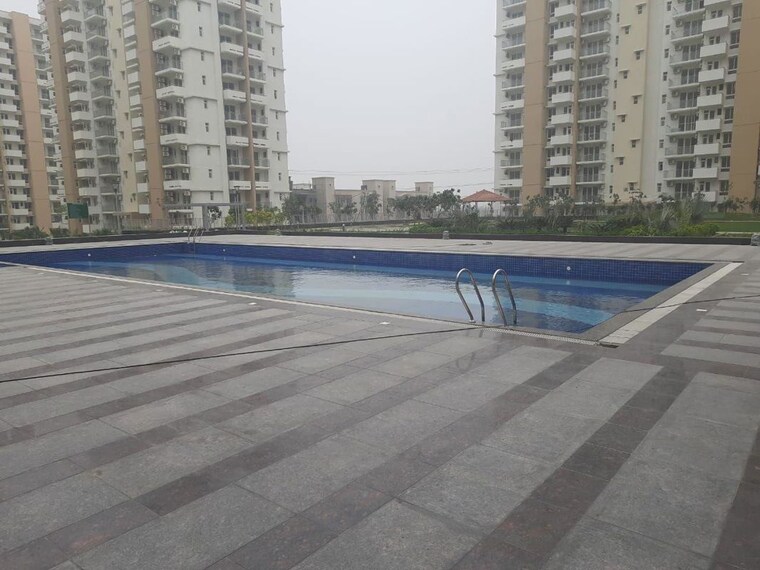 Swimming Pool, emaar-imperial-gardens 3.5 Bedroom 1228 Sq.Ft. Apartment In Sector 102 Gurgaon 10022344