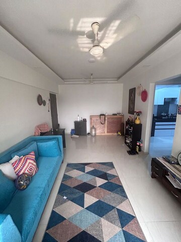 Living Room in 1 BHK Apartment at Lokhandwala Whispering Palms, Kandivali East – for Rent