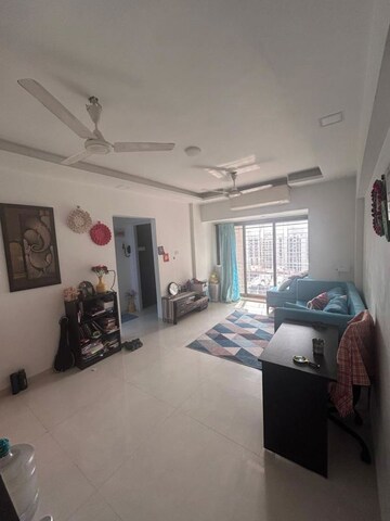 Living Room in 1 BHK Apartment at Lokhandwala Whispering Palms, Kandivali East – for Rent