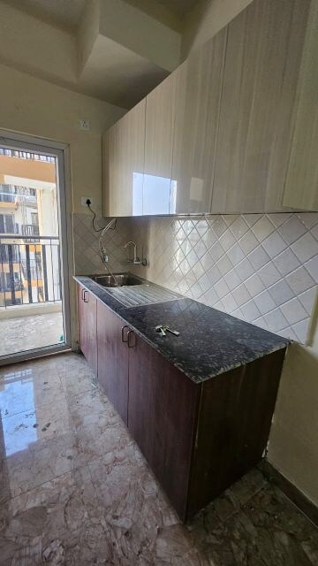 Kitchen in 2 BHK Apartment at Amrapali Golf Homes, Sector 4 Greater Noida – for Sale