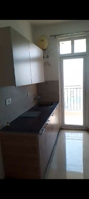 Kitchen in 3 BHK Apartment at ATS Homekraft Pious Hideaways, Sector 150 – for Rent