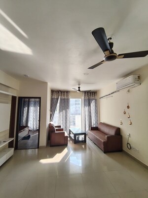 Living Room in 2 BHK Apartment at Urban Axis Urban Woods, Sushant Golf City – for Rent