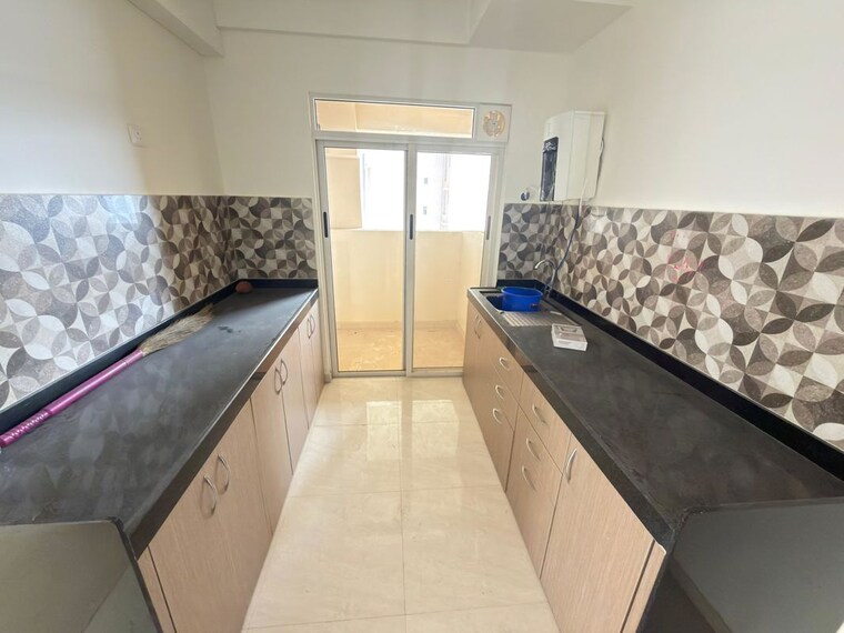 Kitchen, lodha-bella-vita 3 Bedroom 1005 Sq.Ft. Apartment In Nibm Road Pune 10027727