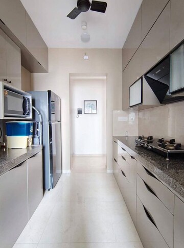 Kitchen in 2 BHK Apartment at Piramal Vaikunth, Balkum Pada – for Rent