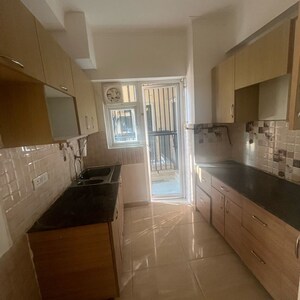 Kitchen in 3 BHK Apartment at Gaur 14th Avenue High Street, Panchsheel Green – for Sale