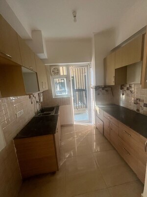 Kitchen in 3 BHK Apartment at Gaur 14th Avenue High Street, Panchsheel Green – for Sale