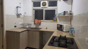 Kitchen in 3 BHK Apartment at Hiranandani Estate Rodas Enclave, Ghodbunder Road – for Rent