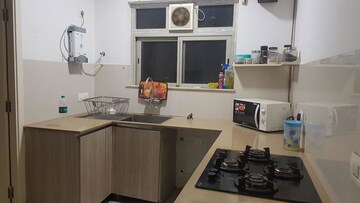 Kitchen in 3 BHK Apartment at Hiranandani Estate Rodas Enclave, Ghodbunder Road – for Rent