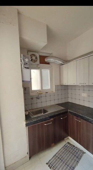Kitchen in 2 BHK Apartment at Urban Axis Urban Woods, Sushant Golf City – for Rent