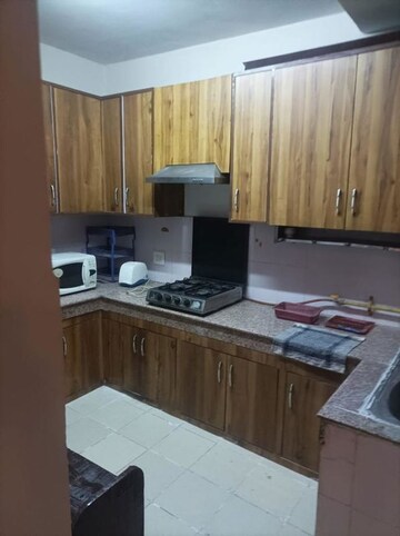 Kitchen in 2 BHK Apartment at Ajnara Integrity, Raj Nagar Extension – for Rent
