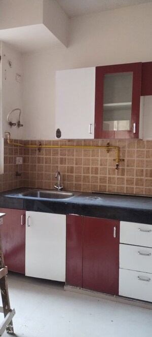 Kitchen in 2.5 BHK Apartment at Mahagun Mywoods, Sector 16c Greater Noida – for Sale