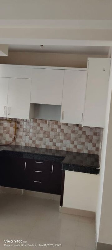 Kitchen in 2 BHK Apartment at Amrapali Golf Homes, Sector 4 Greater Noida – for Sale