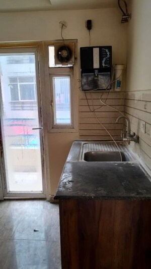 Kitchen in 2 BHK Apartment at Amrapali Golf Homes, Sector 4 Greater Noida – for Sale