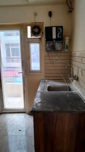 Kitchen in 2 BHK Apartment at Amrapali Golf Homes, Sector 4 Greater Noida – for Sale