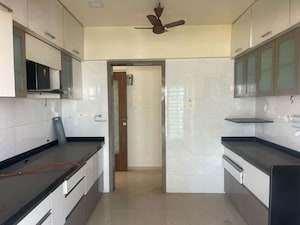 Kitchen in 3 BHK Apartment at Lashkaria Green Towers, Andheri West – for Rent