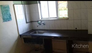 Kitchen in 1 BHK Apartment at Riddhi Enclave Co-op Housing Society Ltd, Viman Nagar – for Rent