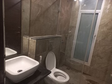 Bathroom in 4 BHK Apartment at Mahagun Mezzaria, Sector 78 – for Sale