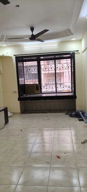 Living Room in 1 BHK Apartment at Shelter CHS, Nerul – for Rent