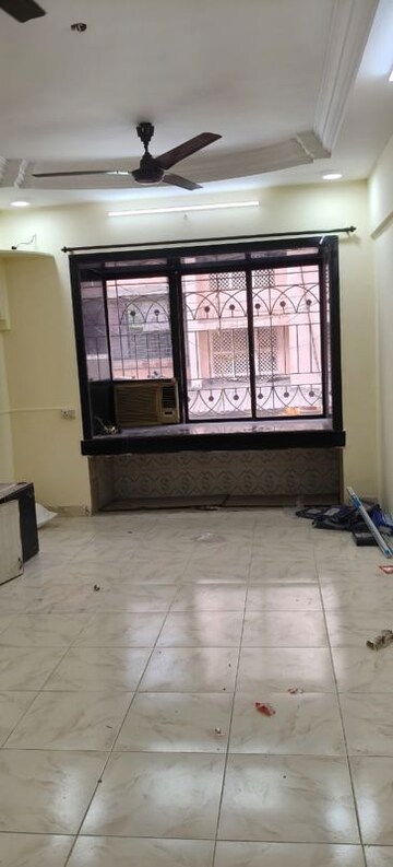 Living Room in 1 BHK Apartment at Shelter CHS, Nerul – for Rent