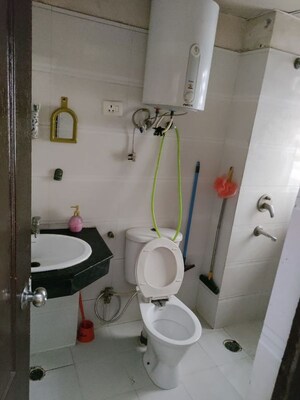 Bathroom in 2 BHK Apartment at Charms Castle, Raj Nagar Extension – for Sale