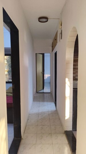 Building Lobby in 2 BHK Apartment at Karachi Citizens CHS, Juhu – for Rent