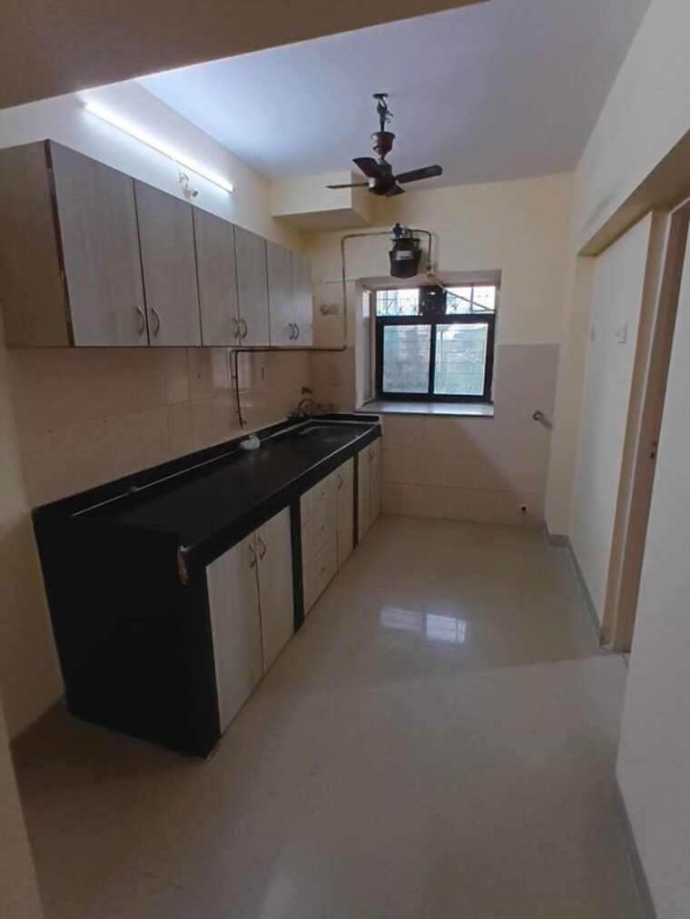 Kitchen, lokhandwala-whispering-palms 2 Bedroom 930 Sq.Ft. Apartment In Lokhandwala Mumbai 10036394