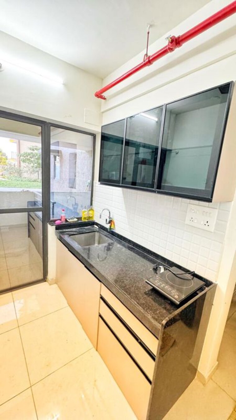 Kitchen, shapoorji-pallonji-vahana-yahavi-phase-1 3 Bedroom 1050 Sq.Ft. Apartment In Bavdhan Pune 10036594