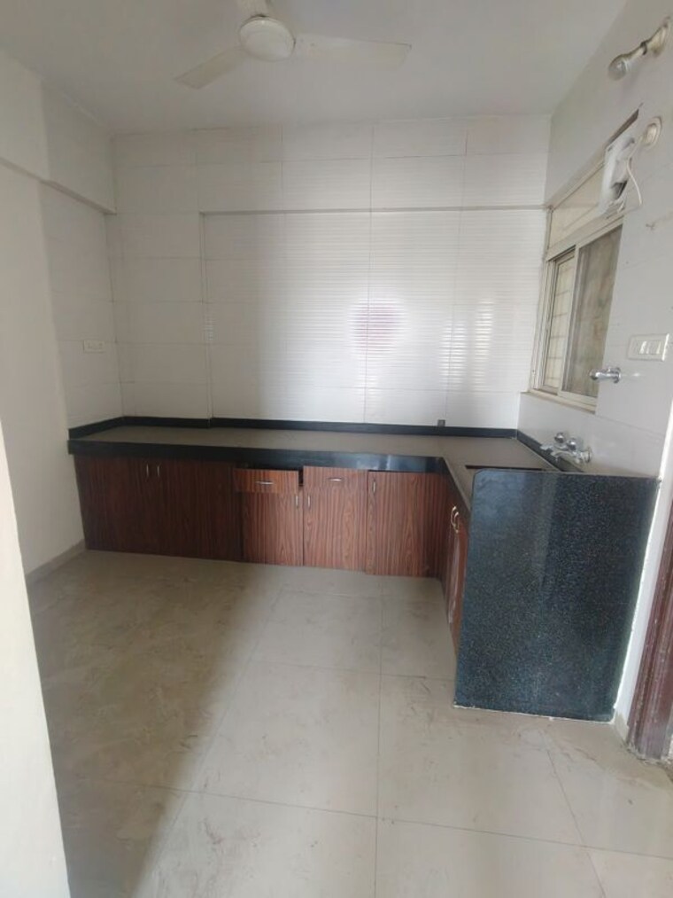 Kitchen, shagun-sunshine-hills 2 Bedroom 950 Sq.Ft. Apartment In Pisoli Pune 10036630