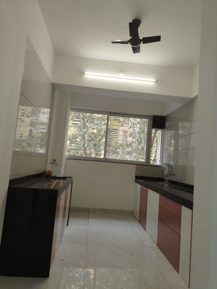 Kitchen, whispering-winds-phase-1 2 Bedroom 750 Sq.Ft. Apartment In Baner Pune 10039583
