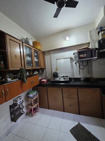 Kitchen in 2 BHK Apartment at Shree Satya Shankar Residency, Manpada – for Rent