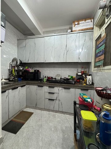 Kitchen in 2 BHK Builder Floor at Palm Residency Chhatarpur, Rajpur Khurd Extension – for Rent