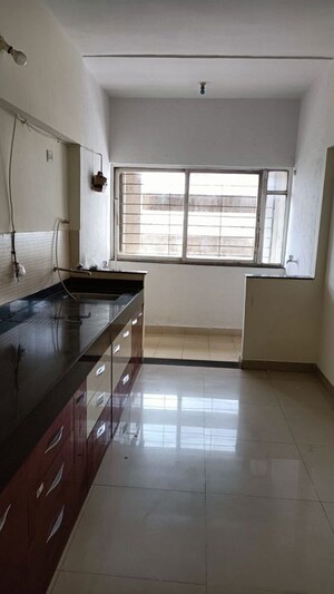 Kitchen in 3 BHK Apartment at Kumar Park Infinia, Fursungi – for Rent