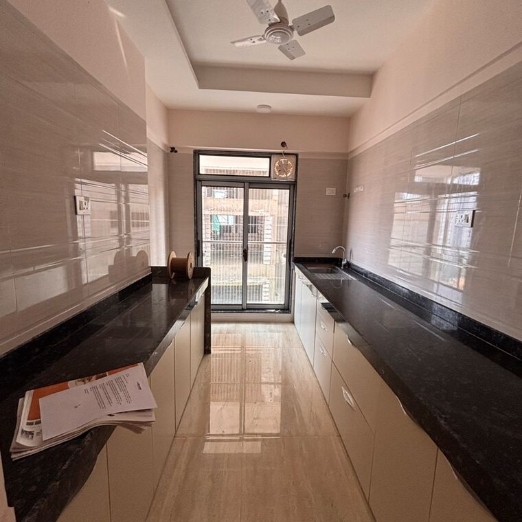 Kitchen, je-and-vee-om-trimurti 2 Bedroom 591 Sq.Ft. Apartment In Dindoshi Mumbai 10040111