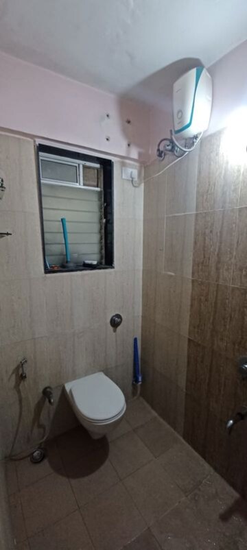 Bathroom in 2 BHK Apartment at Vraj Green Valley, Kolshet Industrial Area – for Rent