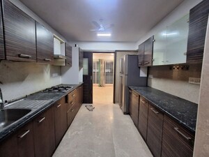 Kitchen in 4 BHK Apartment at Bhagwati Apartments, Santacruz West – for Rent